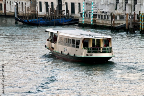 A view on a vaporetto boat in the Grand Canal in Venice photo