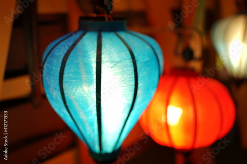 Night view of Colourful cloth lanterns lamp light shades hanging outside - ランタン 明かり 夜景 © Eric Akashi