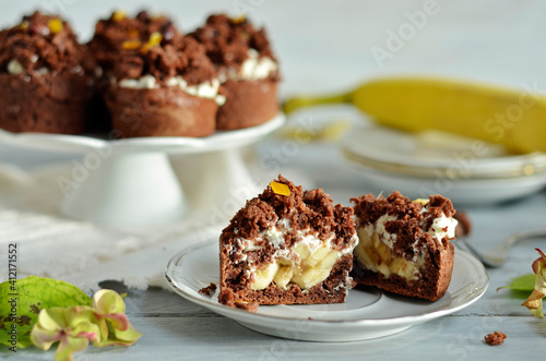 Chocolate cupcake stuffed with bananas on a white plate
