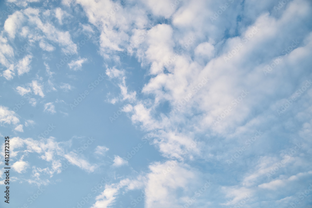 Blue sky background with white clouds on sunny day in summer. Natural scenery. Environmental protection concept. Blue sky background with white clouds on sunny day in summer. Natural scenery. Environmental protection concept.