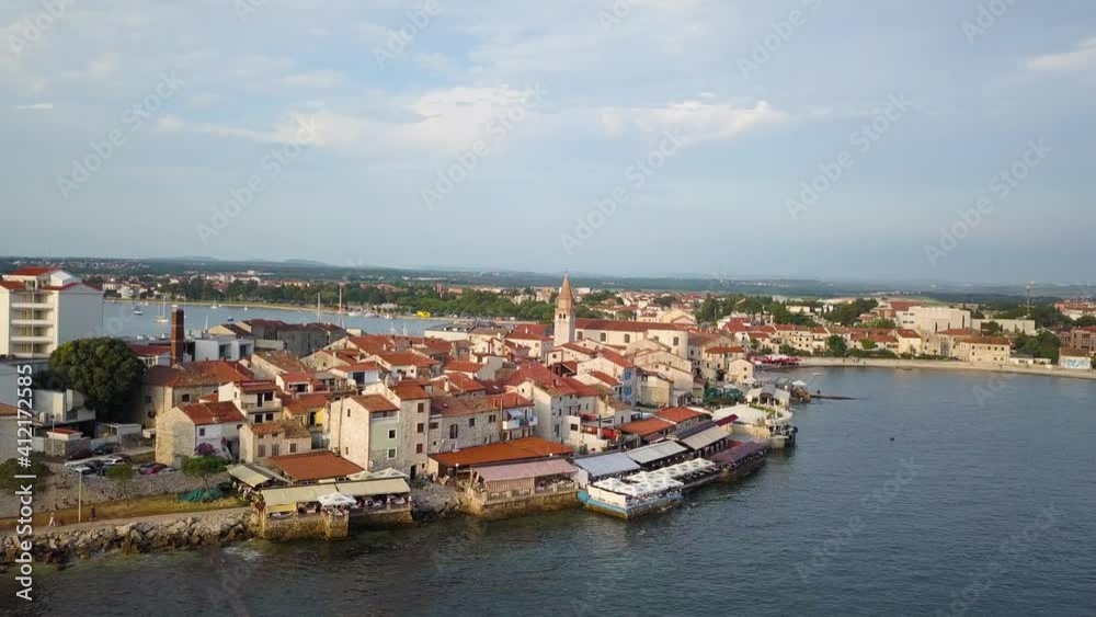 Aerial view of Umag town center with church tower during the summer, Croatia. Aerial view of Umag town center with church tower during the summer, Croatia.