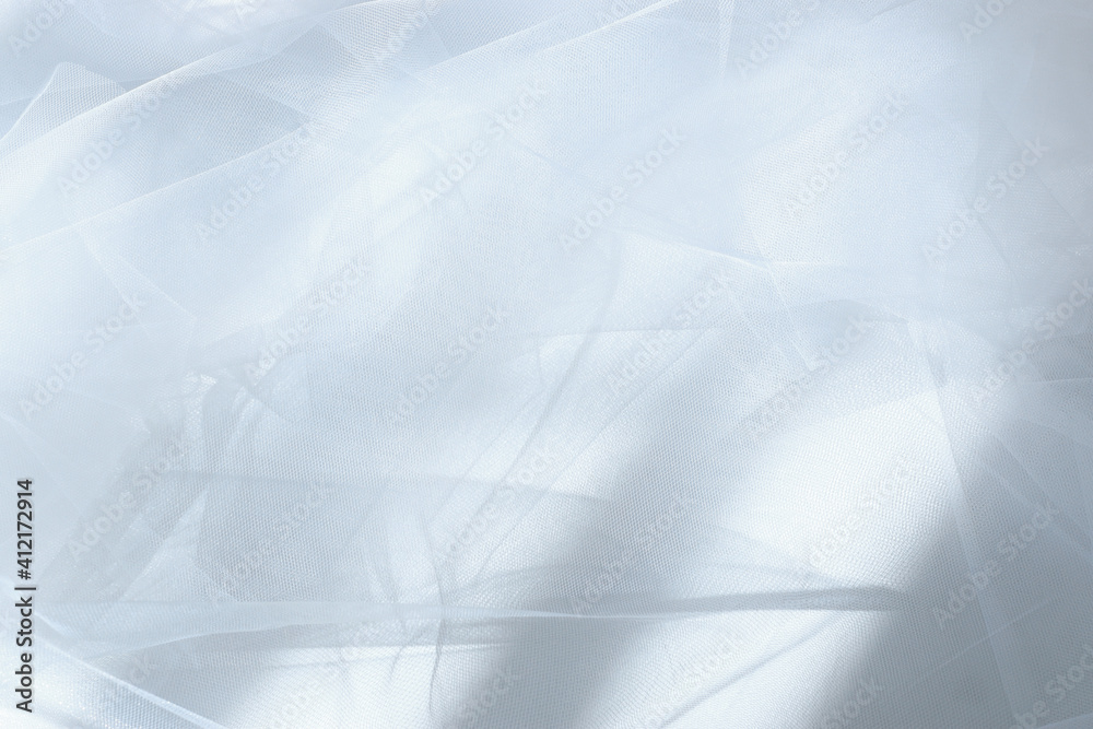 Fototapeta premium Vintage white tulle chiffon texture background with shadows
