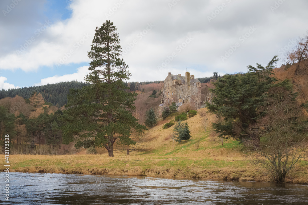View of the the historic Neidpath Castle along the River Tweed in countryside landscape at Peebles in the Scottish Borders, Scotland. View of the the historic Neidpath Castle along the River Tweed in countryside landscape at Peebles in the Scottish Borders, Scotland.