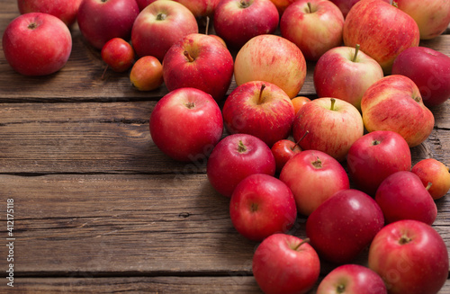 red apples on old wooden background