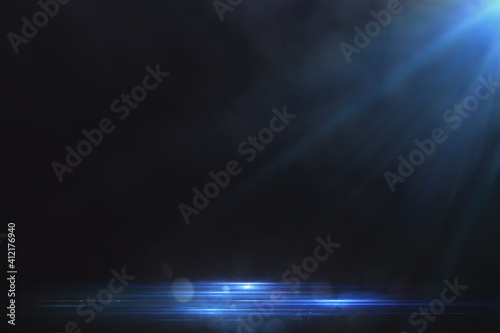 Blue spotlight background and glowing electric blue lines on the floor