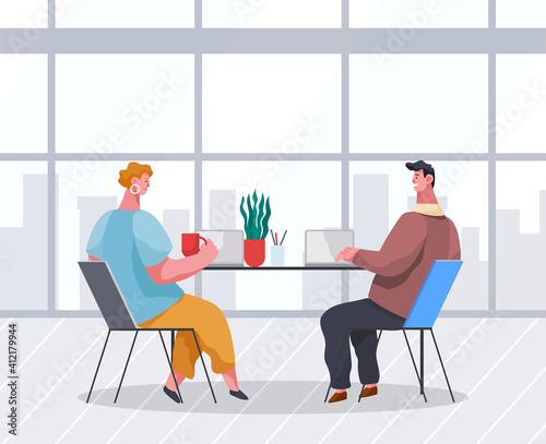 Businessmen dressed in formal clothes are sitting at the table with laptops and talking. Office workers discussing matters. Business meeting and consideration of working issues. Friendly team work