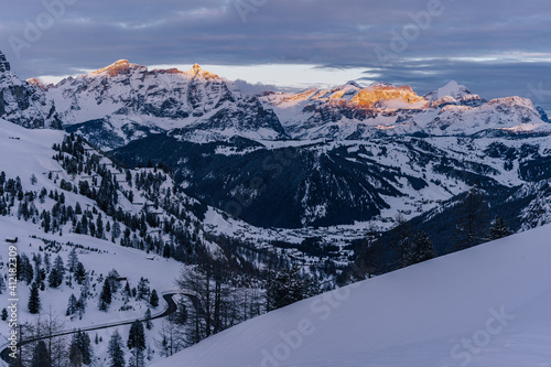 Beautiful winter sunset alpine landscape of Dolomiti, South Tyrol. Mountains around Passo Gardena, Alto Adige, Dolomites. Gran Cir, Sella Ronda, Sassolungo.