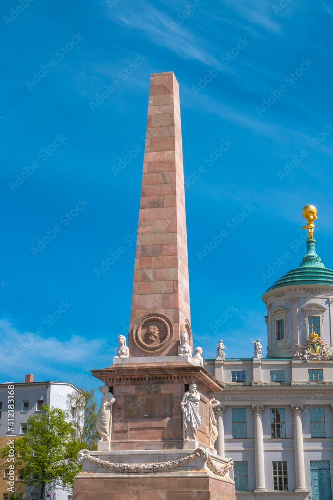 Obelisk with sphynx statues at the Evangelical church Saint Nikolai at blue sky Potsdam, Germany, details, closeup.