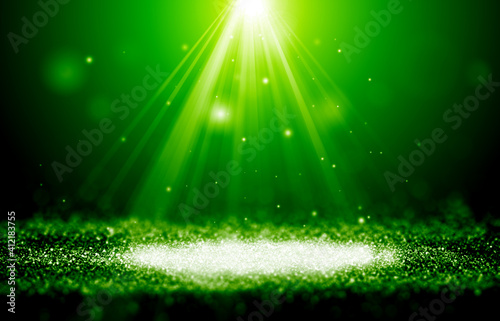 Green sparkle rays glitter lights with spotlight bokeh elegant show on stage abstract background. Dust sparks background.Spotlight background © narongchaihlaw