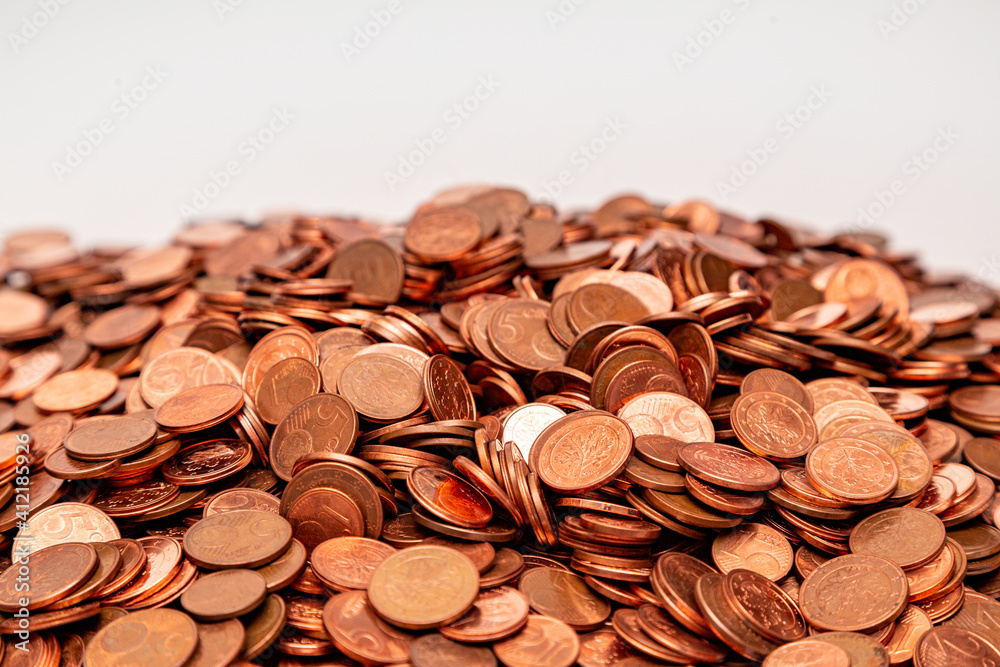 Many small euro coins on each other on white background Many small euro coins on each other on white background