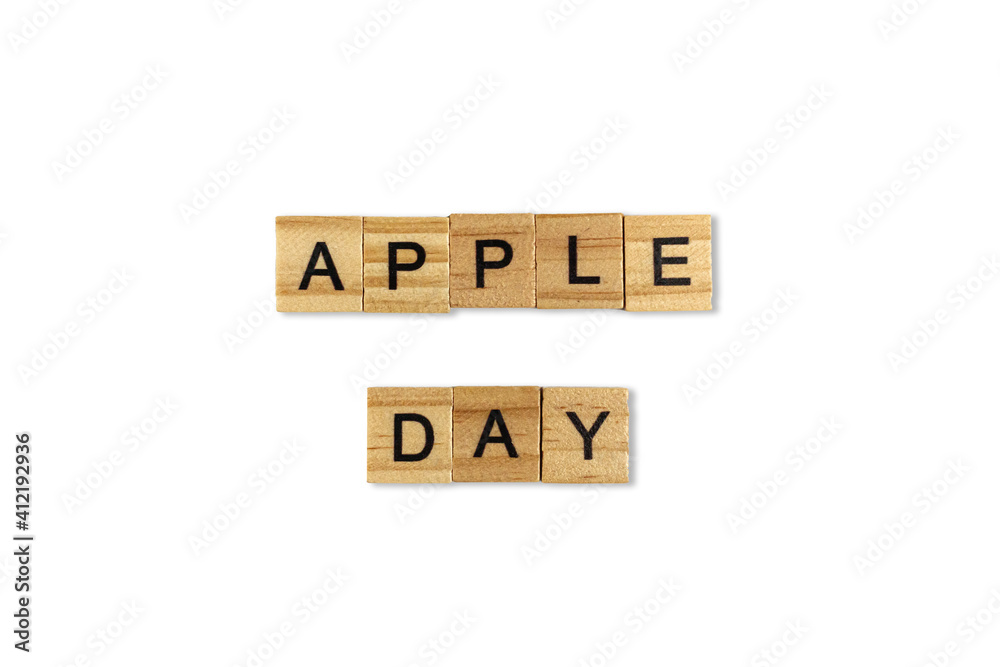 Top view of the word apple day laid out from square wooden tiles isolated on white background. World and international day. Top view of the word apple day laid out from square wooden tiles isolated on white background. World and international day.