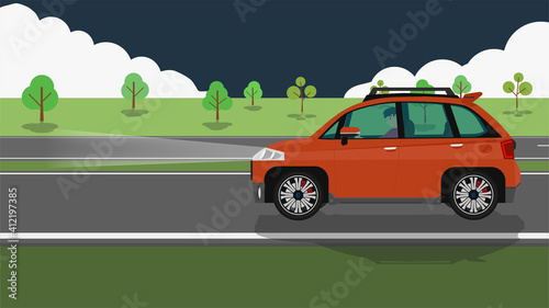 Driving man in personnel car orange color.  Drive on the asphalt road alone with turn light at night. Environment of green meadow and trees.