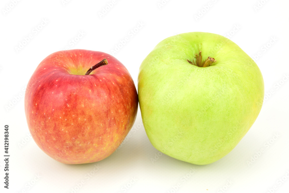 Red and green apples lying side by side and isolated on white background Red and green apples lying side by side and isolated on white background