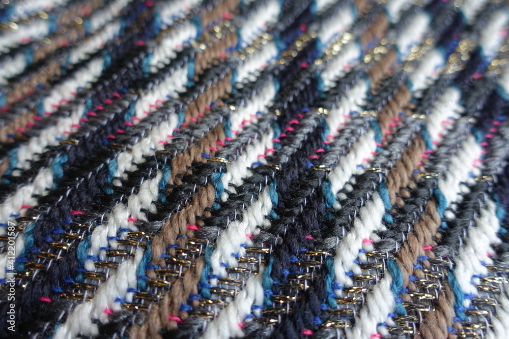 Closeup of multicolored tweed fabric with lurex
