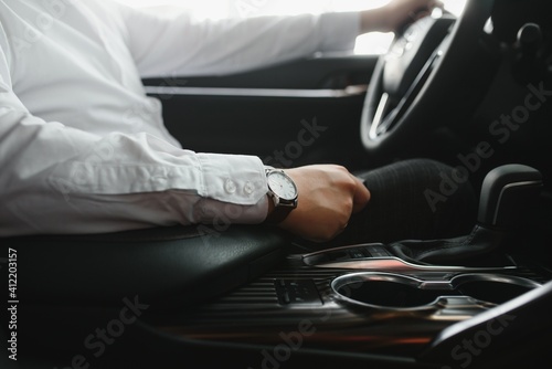 Close-up Of Person's Hand Changing Gear While Driving Car © Serhii