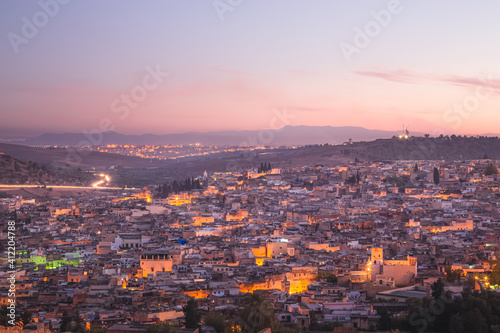 Sunrise or sunset cityscape skyline view of the old town of Fez  Morocco  the country s second largest city renowned for its historic Fes el Bali walled medina.