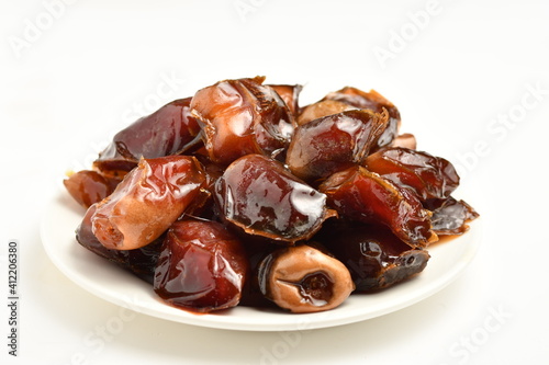 dates fruit , famous for it in the regions of [Al-Qatif, Al-Qassim, Al-Kharj and Al-Hasa] in Saudi Arabia. It is characterized by preserving its good flavor after a long period of storage. photo