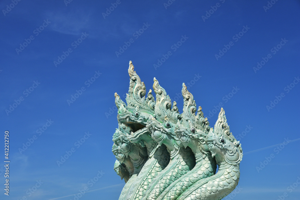 Fototapeta premium Multi Head Naka Statue Under Blue Sky