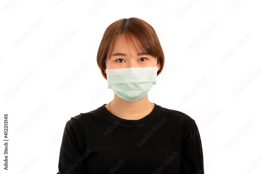 Young nice asian girl with blonde hair wearing hygienic protective surgical mask to prevent airborne disease infection, isolated on white background Young nice asian girl with blonde hair wearing hygienic protective surgical mask to prevent airborne disease infection, isolated on white background