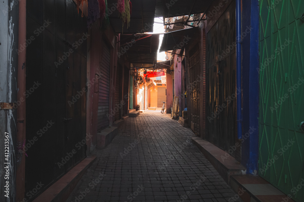 Fototapeta premium Empty streets in the souks of Marrakech Medina, Morocco before shops open.