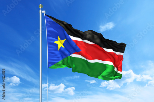 South Sudan flag waving on a high quality blue cloudy sky, 3d illustration