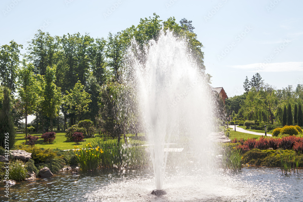 Fountains on the lake in the landscape park Mezhigirya near Kiev, Ukraine.