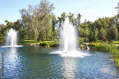 Fountains on the lake in the landscape park Mezhigirya near Kiev, Ukraine.