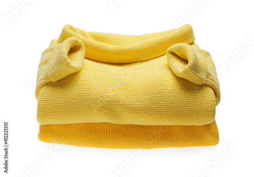 Yellow woolen sweaters on white background. Warm clothes