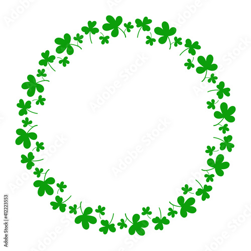 Round frame with clover leaves.Magical plant. Decoration for St. Patrick's Day with trefoils and quatrefoils. Shamrock. Irish