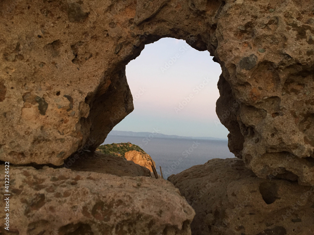 view of the sea from a rock window