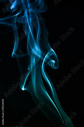 Fototapeta Naklejka Na Ścianę i Meble -  Blue smoke movement shapes isolated on black background