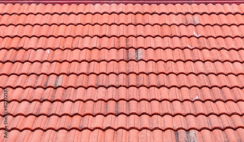 Red clay tile house roof pattern and background seamless photo