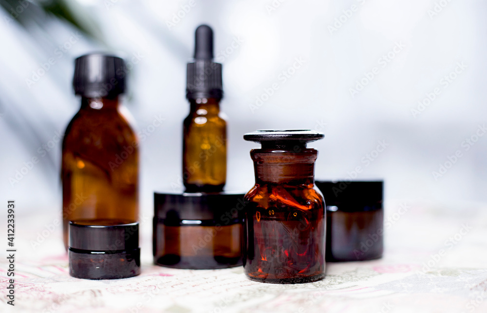 Glass bottles for medicines or cosmetics. Bottles made of dark glass. Glass bottles for medicines or cosmetics. Bottles made of dark glass.