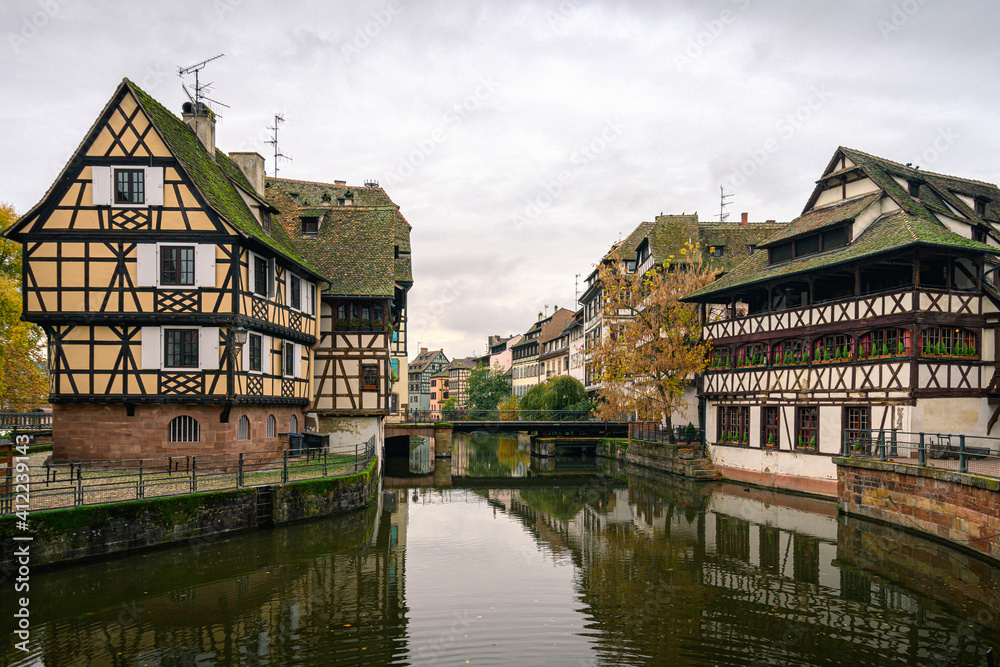 Old buildings in Strasbourg city near channel on an autumn day Old buildings in Strasbourg city near channel on an autumn day