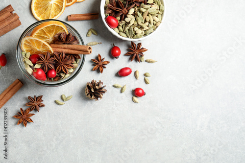 Fototapeta Naklejka Na Ścianę i Meble -  Aroma potpourri with different spices on white table, flat lay. Space for text