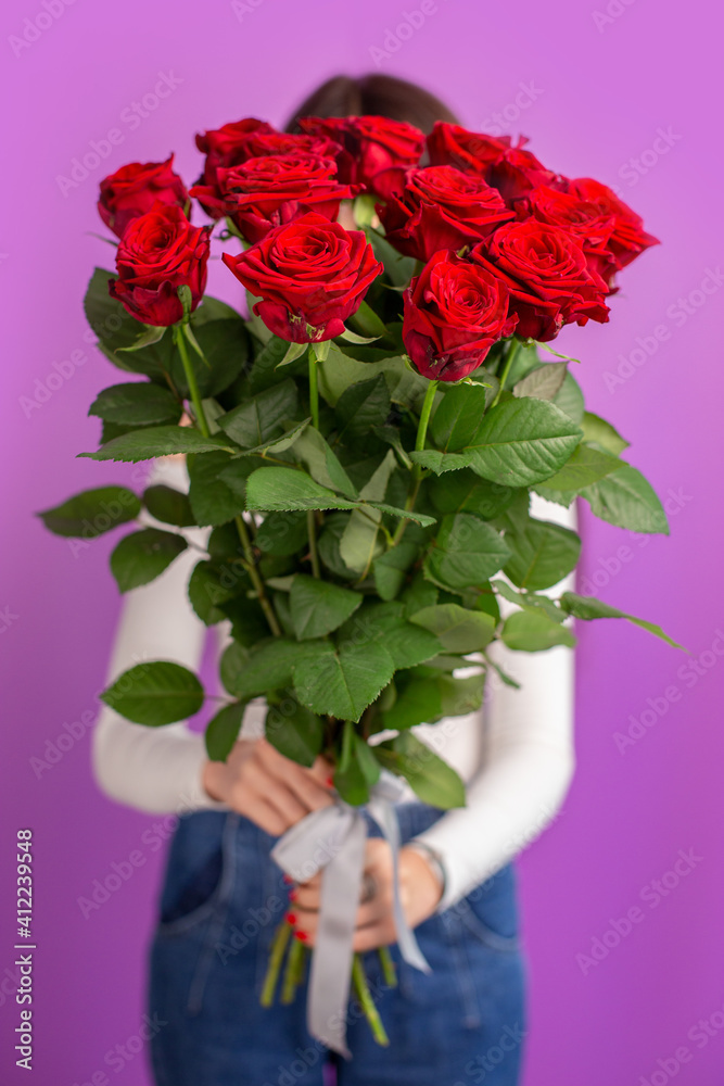 The girl with big bouquet of flower roses