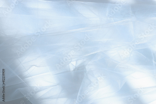 Vintage white tulle chiffon texture background with shadows