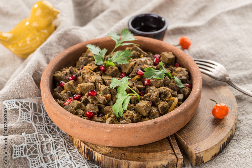 Kuchmachi traditional Georgian dish of chicken livers, hearts and gizzards with walnuts and pomegranate Kuchmachi traditional Georgian dish of chicken livers, hearts and gizzards with walnuts and pomegranate