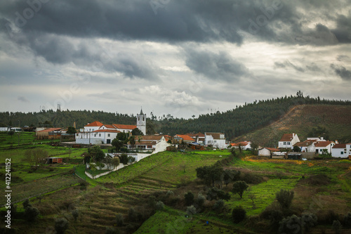 Village on the top of the hills with a winter sky
