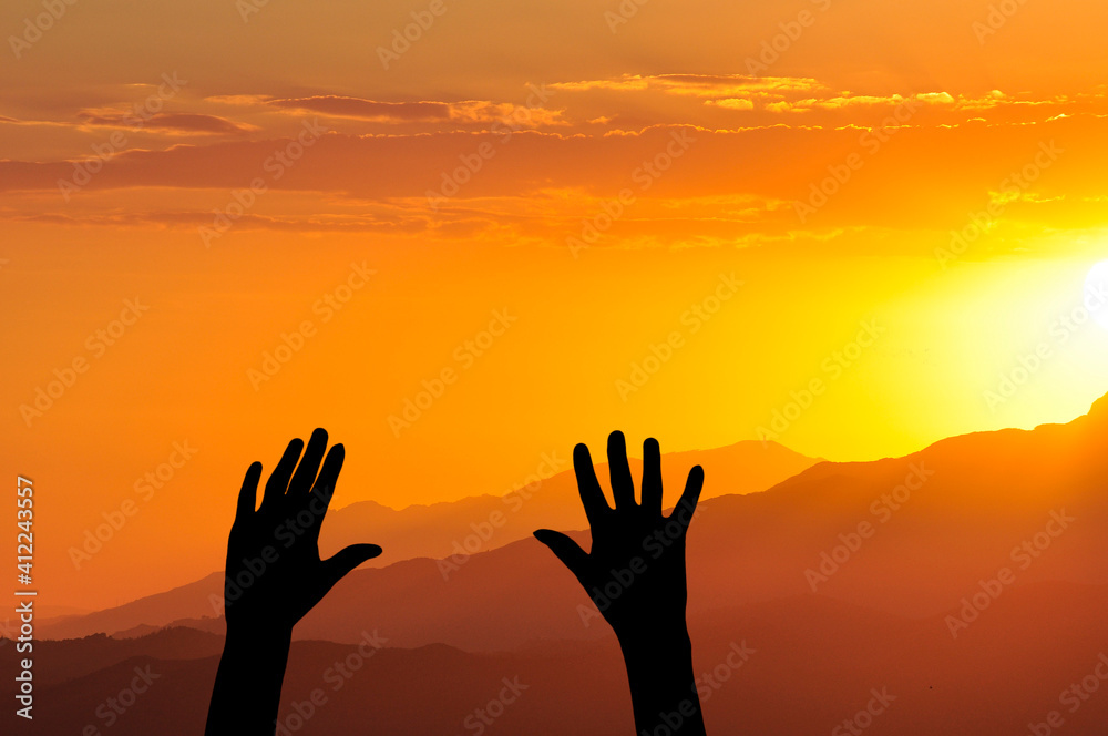 hands up facing the sunset sunrise of the sun