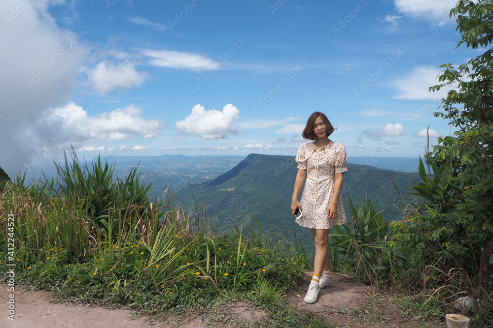 Woman and natre at Phu Tab Berk, Petchaboon, Thailand.