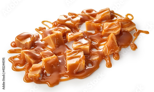 Photography Splash of caramel sauce with fudge candies