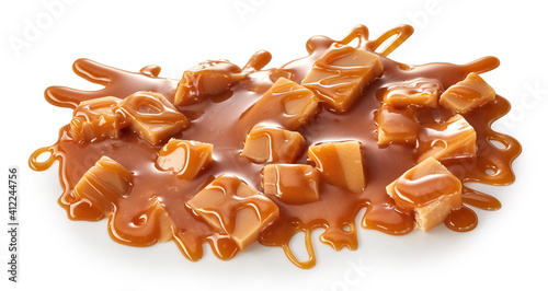 Obraz na płótnie Splash of caramel sauce with fudge candies
