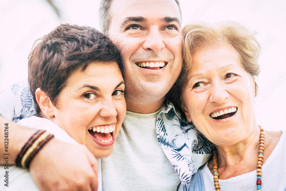 Portrait of happy family different ages adult and mature caucasian people smiling and having fun together - cheerful man and woman in friendship and relationship Portrait of happy family different ages adult and mature caucasian people smiling and having fun together - cheerful man and woman in friendship and relationship