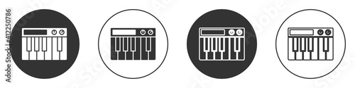 Black Music synthesizer icon isolated on white background. Electronic piano. Circle button. Vector.