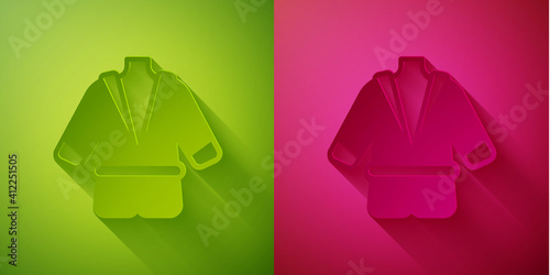 Paper cut Bathrobe icon isolated on green and pink background. Paper art style. Vector.
