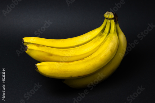 Bananas on a black background. Healthy food. Banana bunch