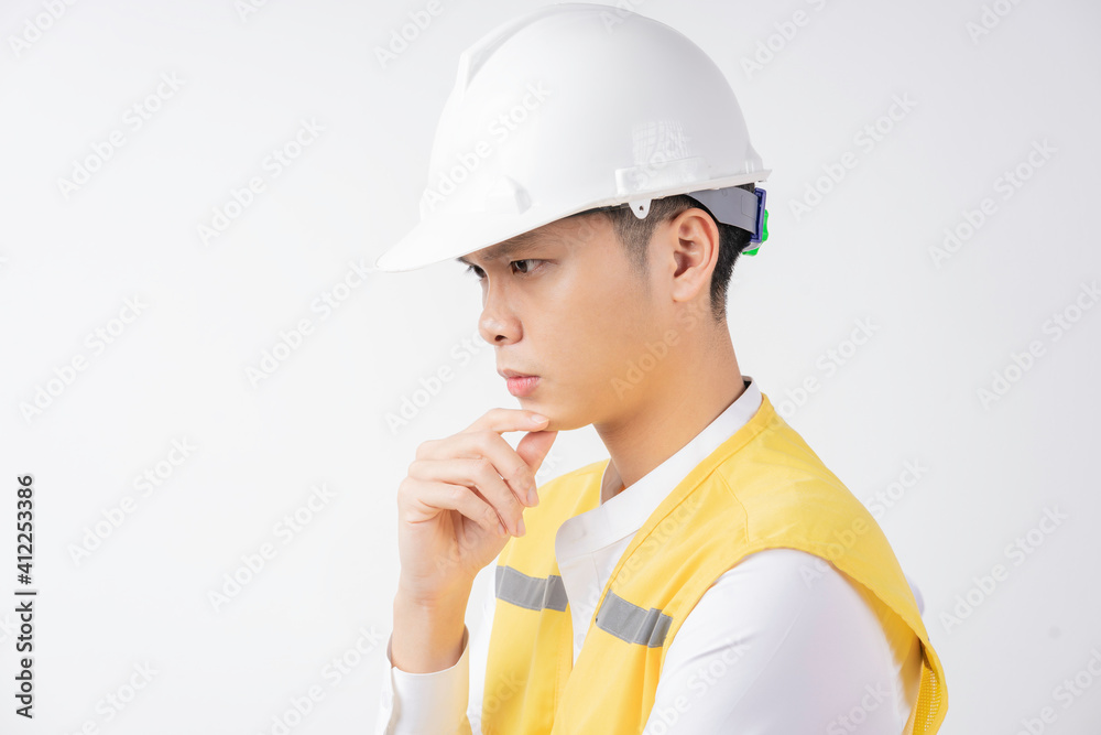 Portrait of male construction engineer thinking on white background Portrait of male construction engineer thinking on white background