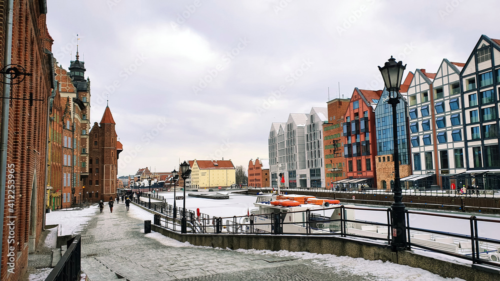Gdansk, Poland - February 7, 2021: Old Town of Gdansk in Poland with Motlava river, Poland. Winter scenery.