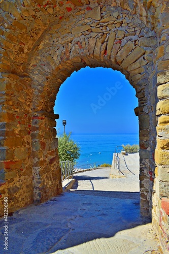 ancient gate of the Castle of Castiglione della Pescaia, a famous medieval town overlooking the Tuscan coast in the province of Grosseto, Italy photo